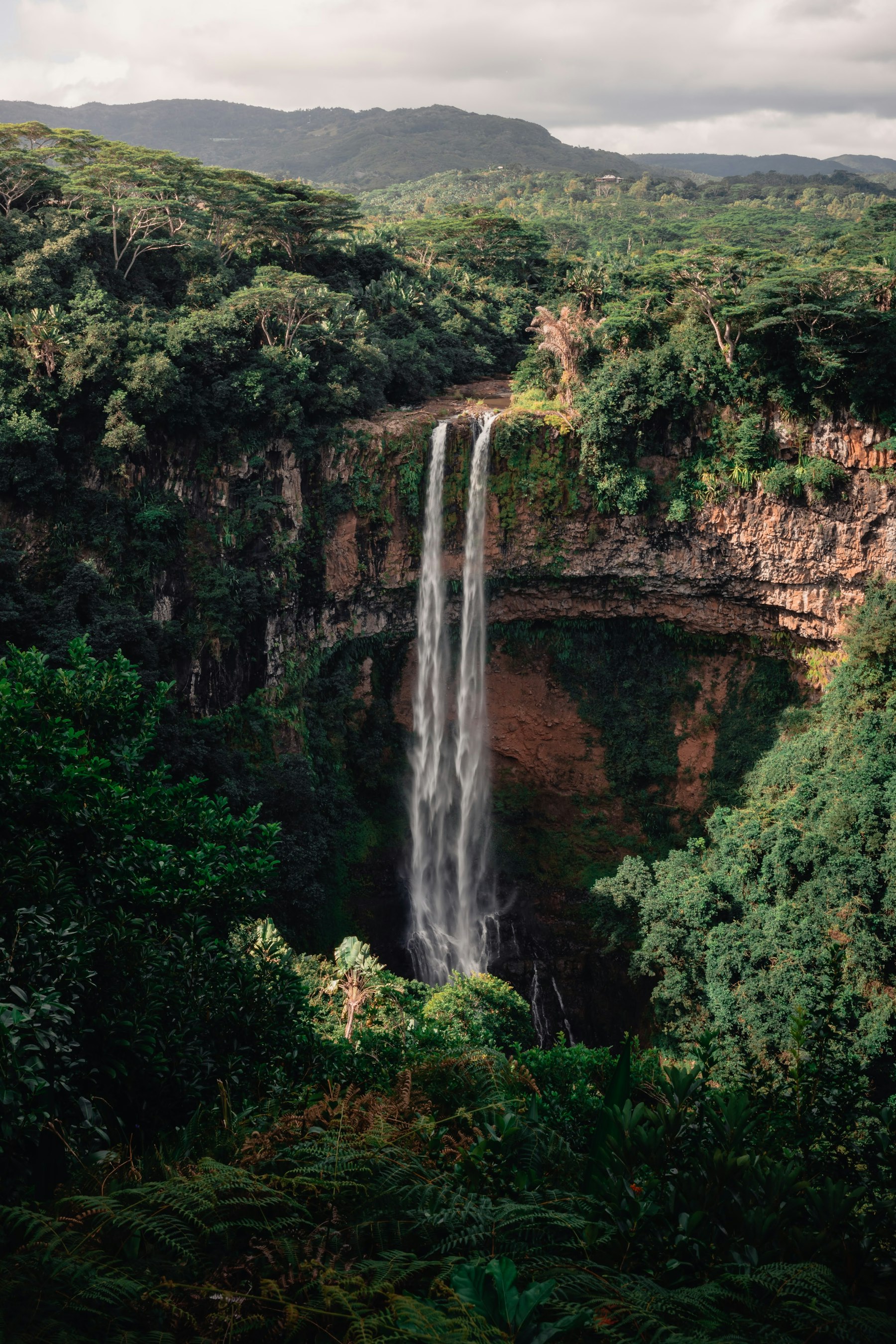 Chamarel waterfall falling into forest